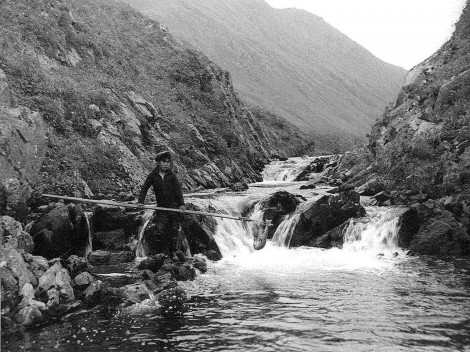 Old-photo-young-boy-netting-fish-on-creek